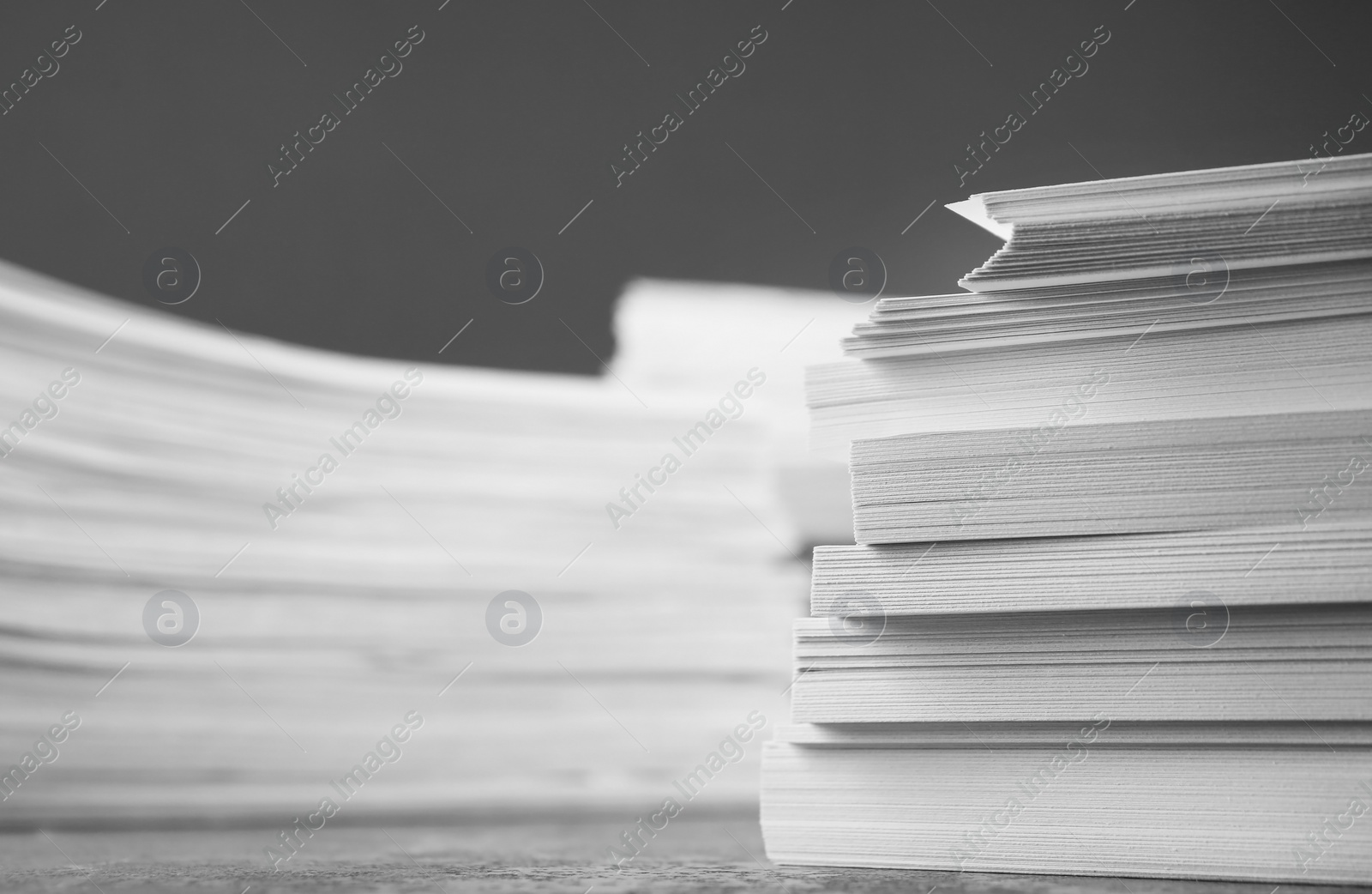 Photo of Stack of blank white paper on table, closeup. Space for text