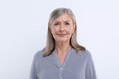 Photo of Portrait of beautiful senior woman on white background