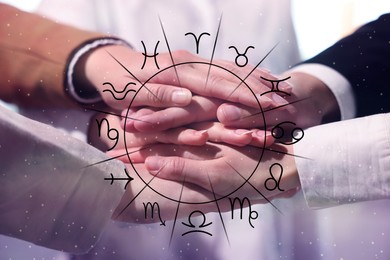 Image of Relationships and horoscope. Zodiac wheel and photo of people joining hands together, closeup