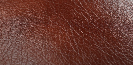 Photo of Texture of brown leather as background, closeup