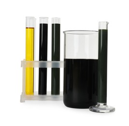 Photo of Laboratory glassware with different types of crude oil isolated on white