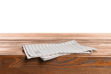Photo of Checkered tablecloth on wooden table against white background