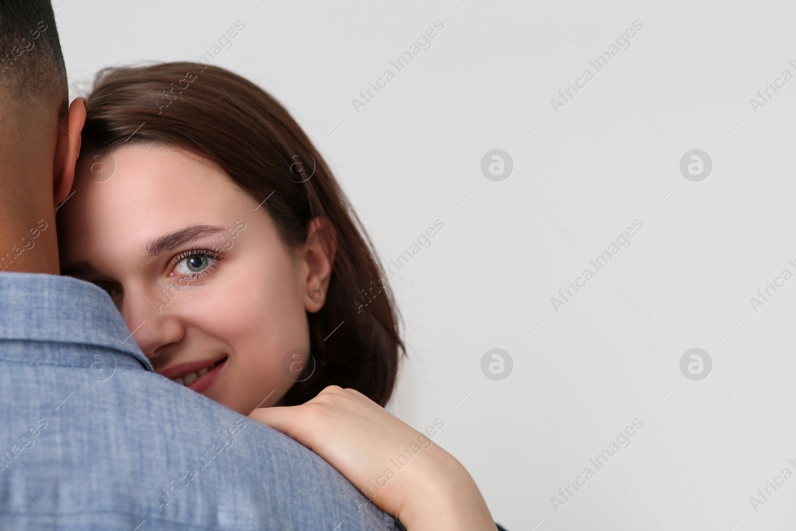 Photo of Dating agency. Woman with her boyfriend on white background, space for text