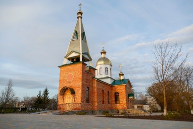 Photo of Beautiful view of village church on spring day