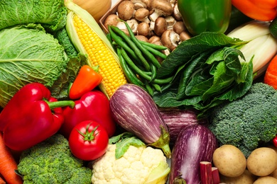 Photo of Different fresh vegetables as background, closeup view