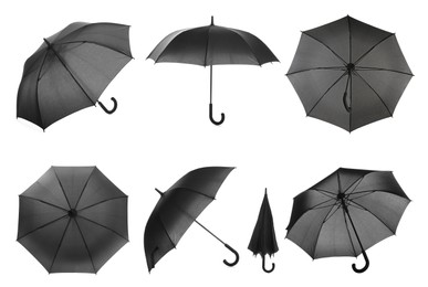Image of Set with stylish black umbrellas on white background