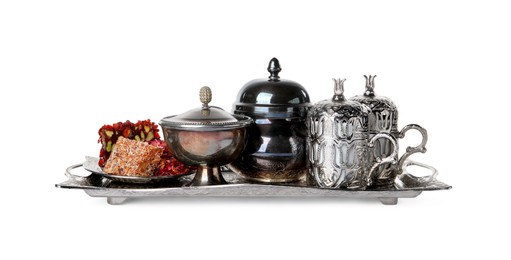 Photo of Tea and Turkish delight served in vintage tea set on white background