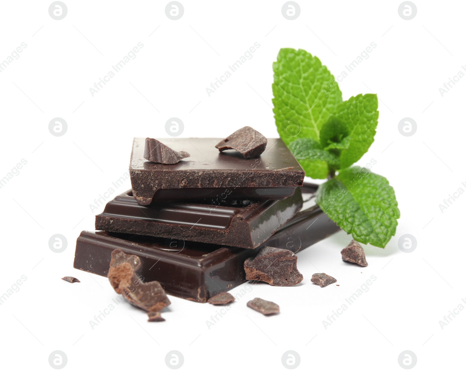 Photo of Tasty dark chocolate pieces with mint on white background