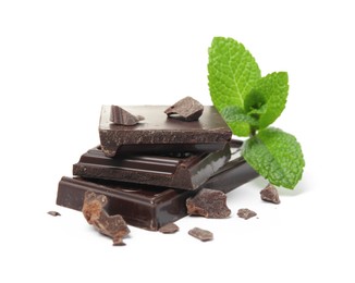 Photo of Tasty dark chocolate pieces with mint on white background