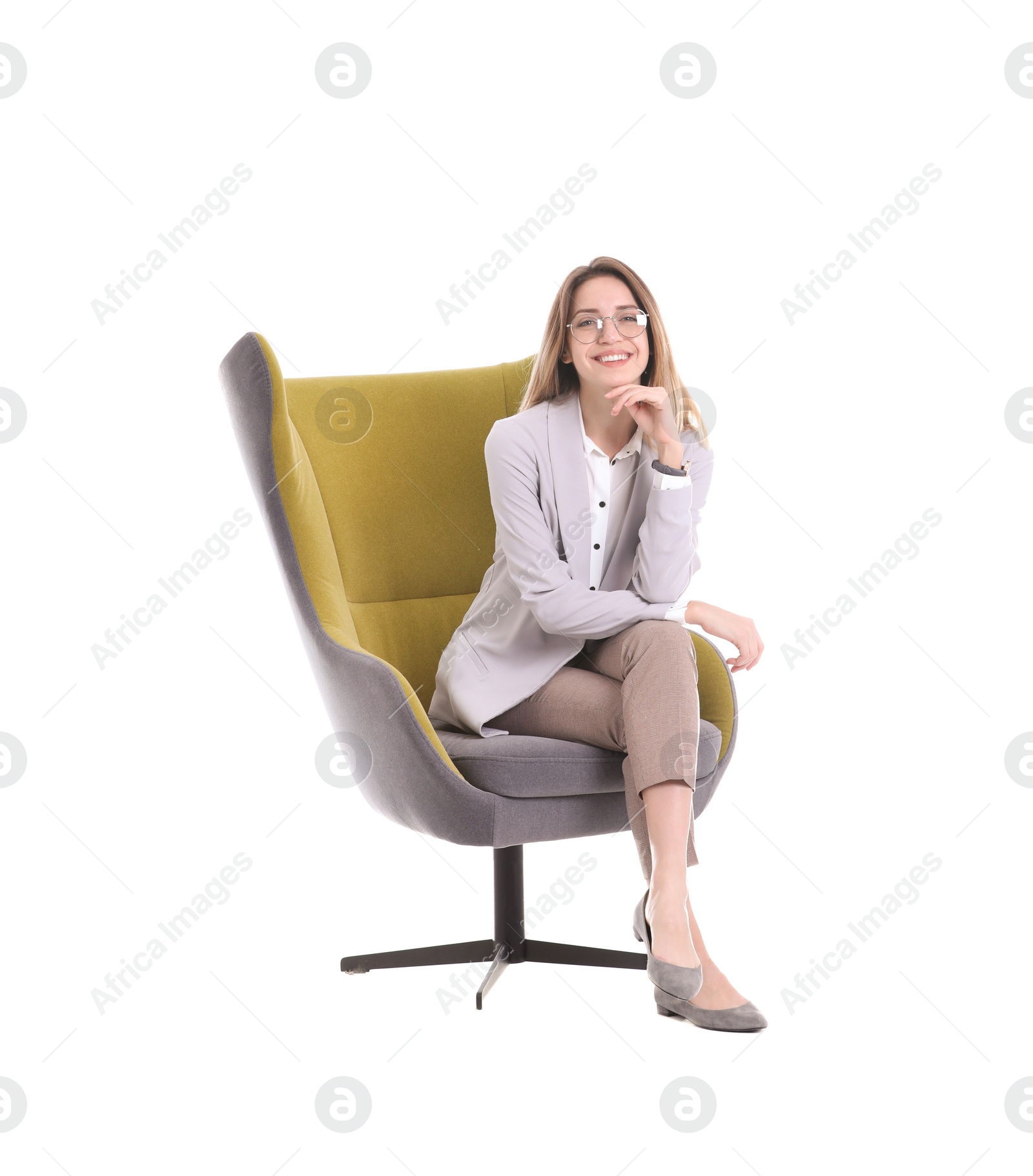 Photo of Young woman sitting in armchair on white background