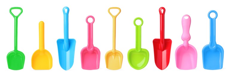 Image of Different bright plastic toy shovels on white background, collage. Banner design