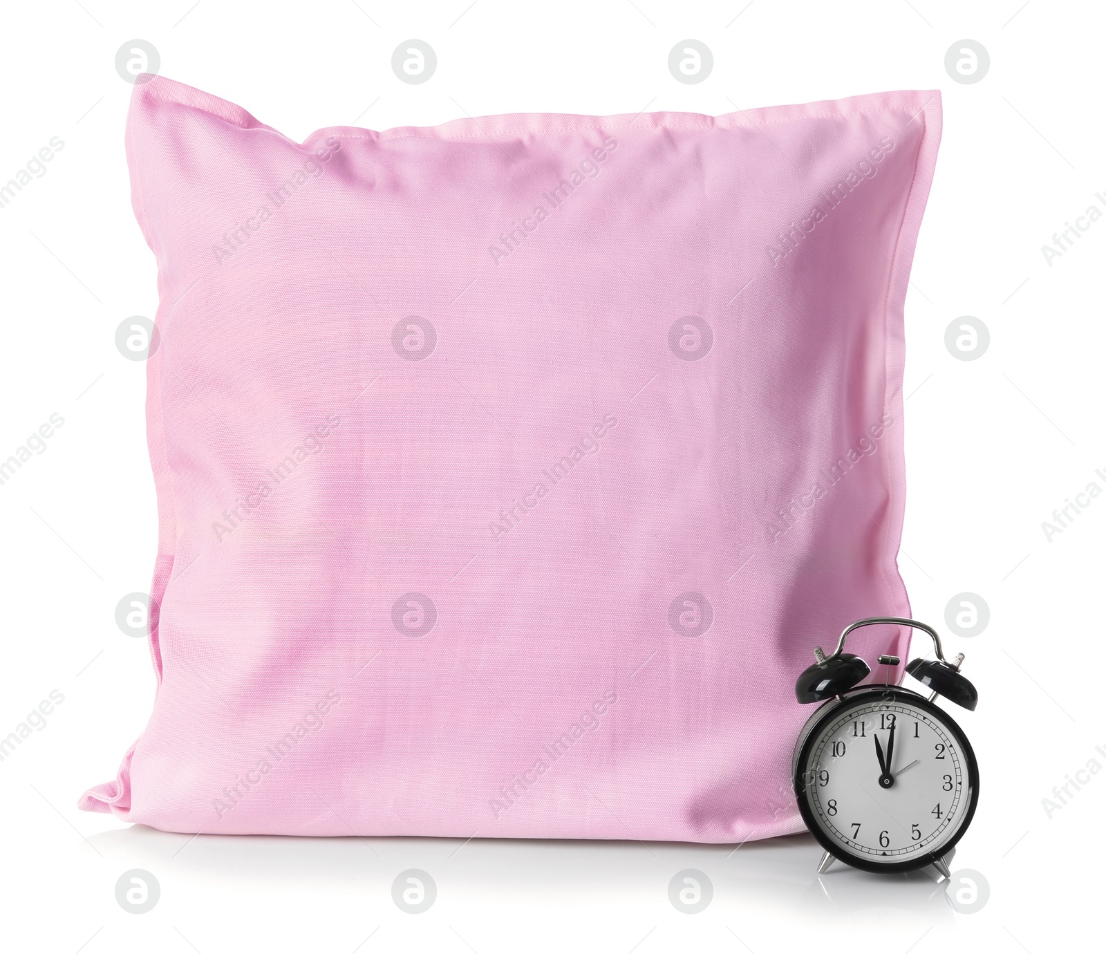 Photo of Soft decorative pillow and alarm clock on white background