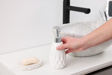 Bath accessories. Woman with container of cosmetic product indoors, closeup and space for text