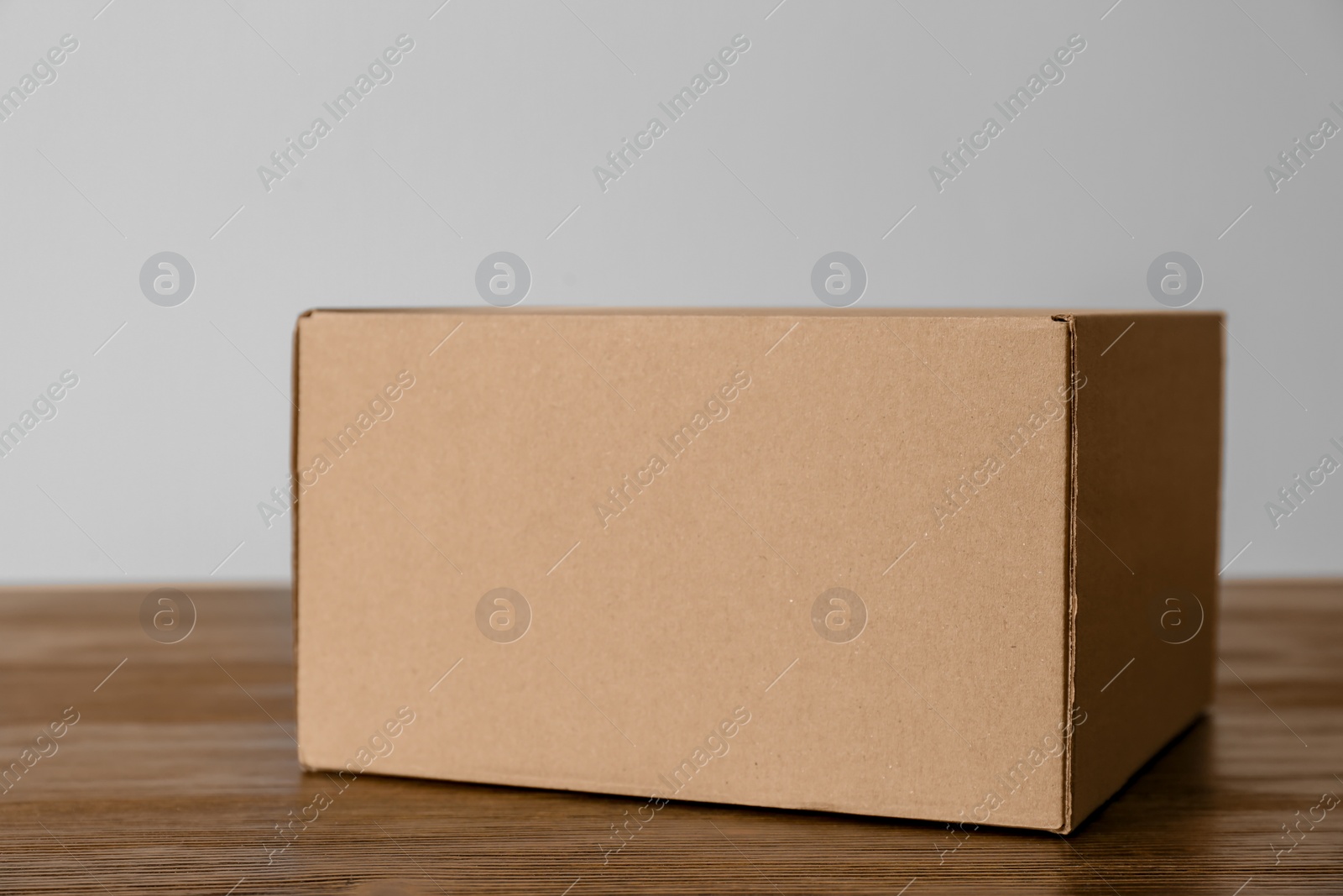 Photo of Cardboard box on wooden table