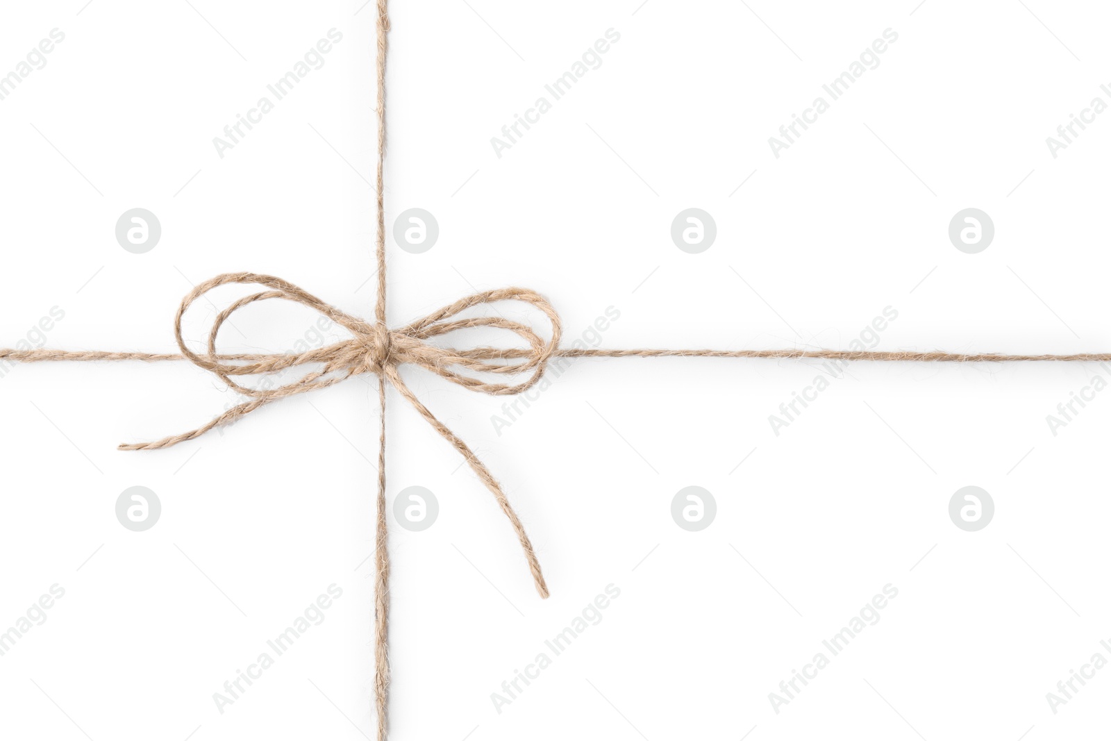 Photo of Linen rope string with bow isolated on white, top view