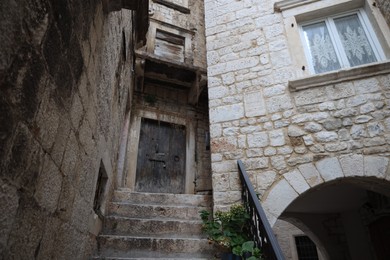 Beautiful old building with stairs and windows, low angle view
