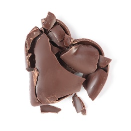 Crushed heart shaped chocolate candy on white background, top view