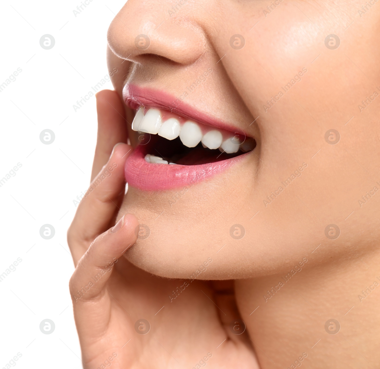 Photo of Young woman with beautiful smile on white background, closeup. Teeth whitening