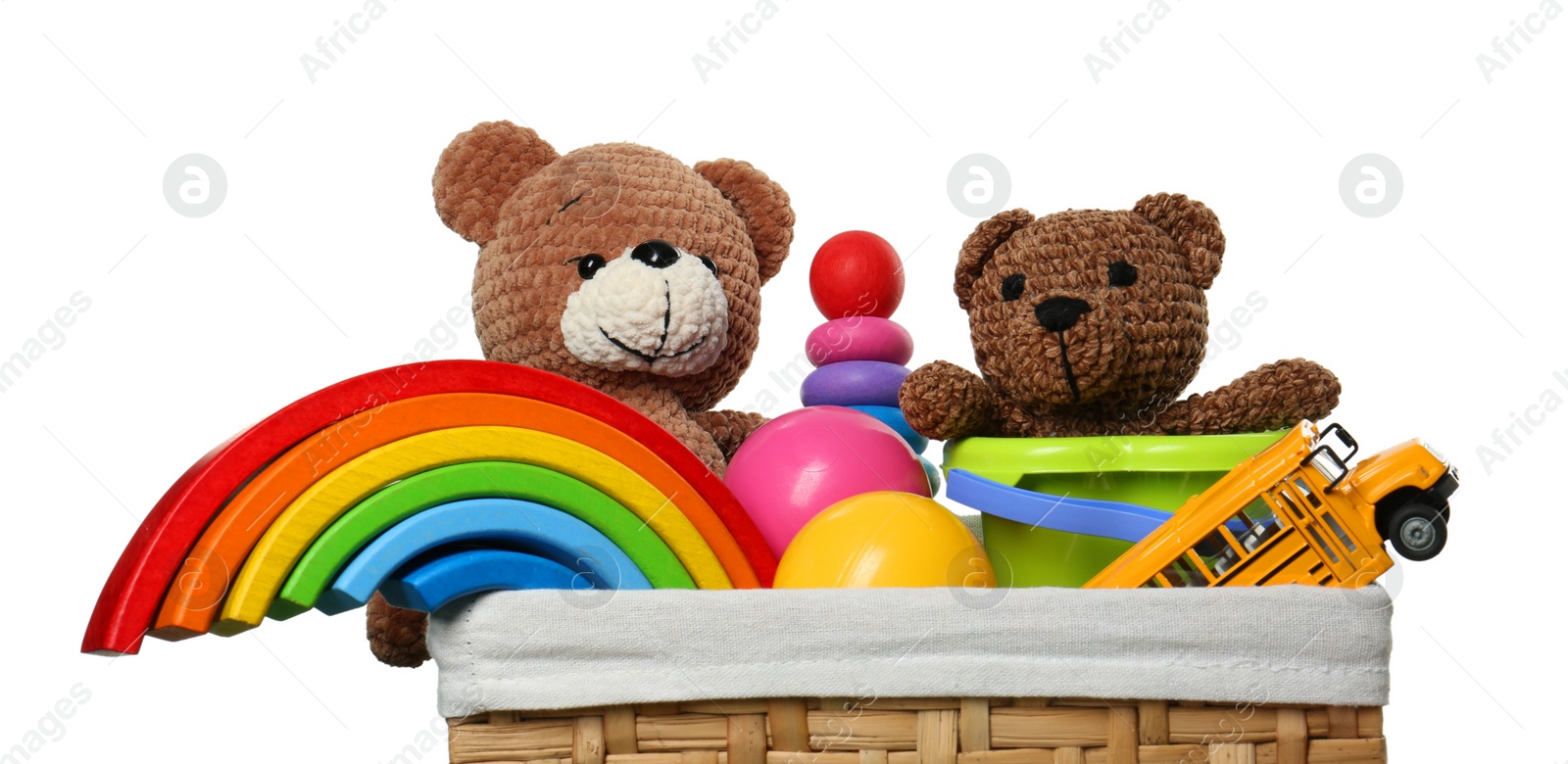 Photo of Wicker basket with different children's toys isolated on white