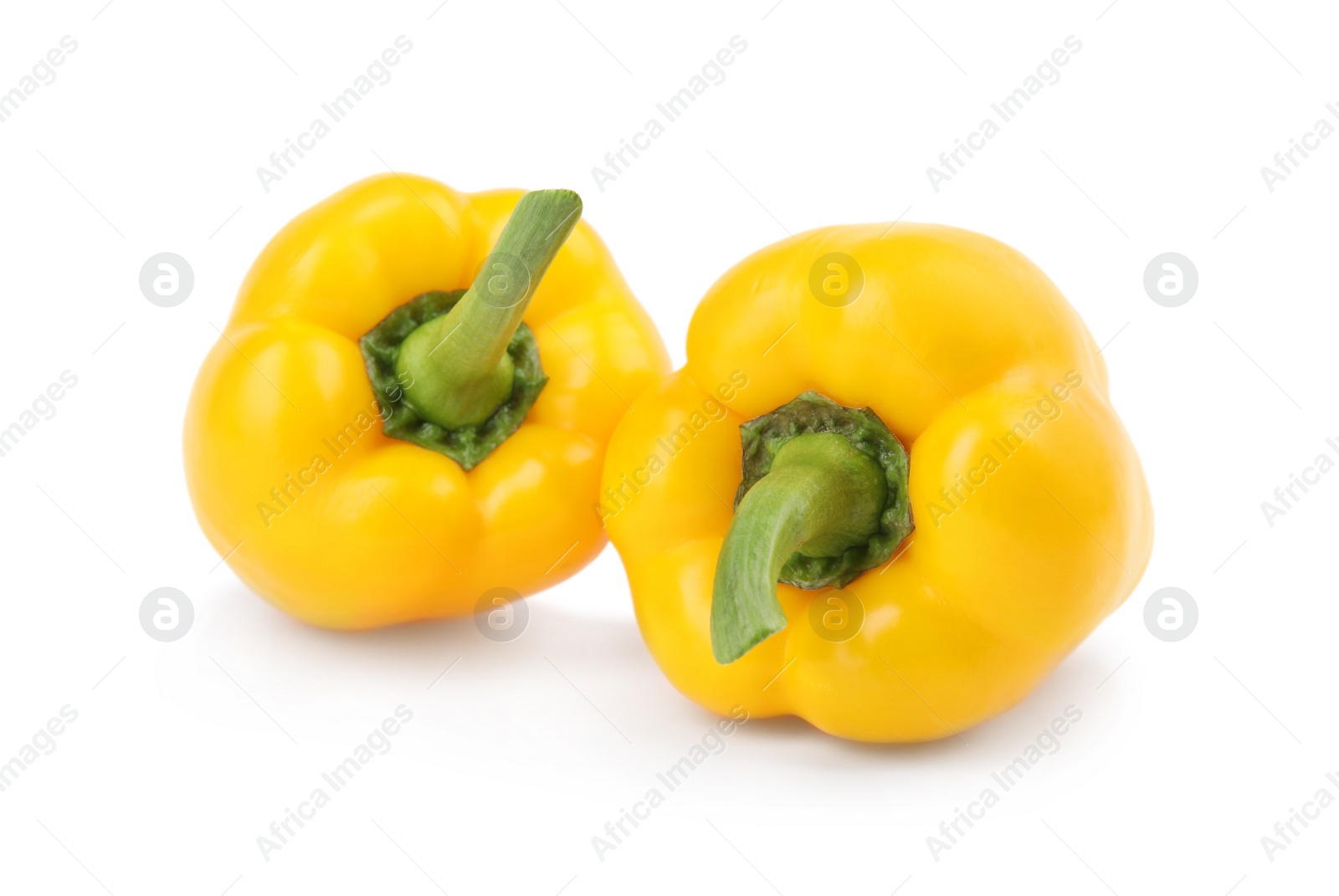 Photo of Ripe yellow bell peppers isolated on white