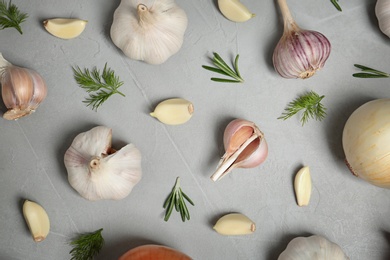 Photo of Flat lay composition with garlic on table