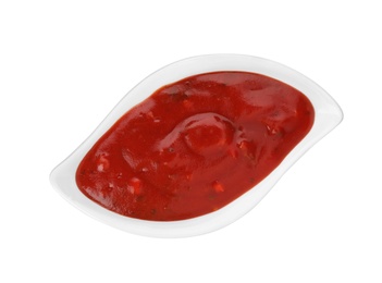 Photo of Gravy boat with spicy chili sauce on white background, top view