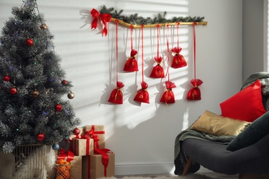 Beautiful interior with New Year advent calendar on white wall