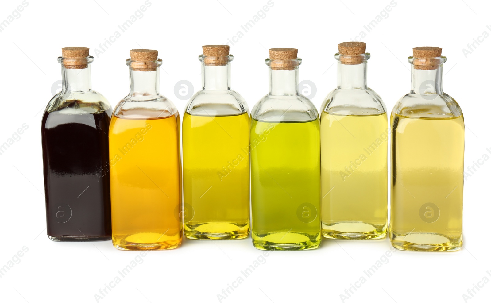 Photo of Vegetable fats. Bottles of different cooking oils isolated on white