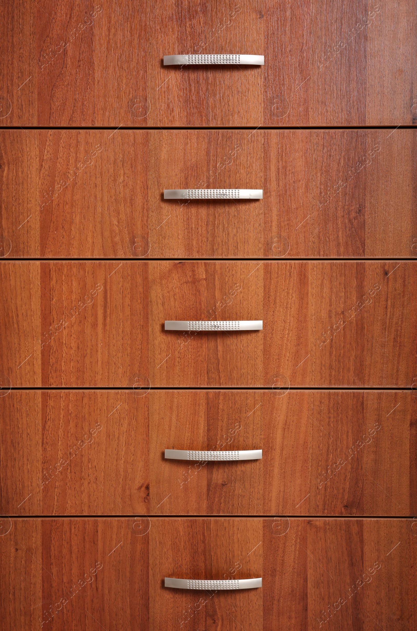 Photo of Wooden wardrobe drawers as background, closeup view