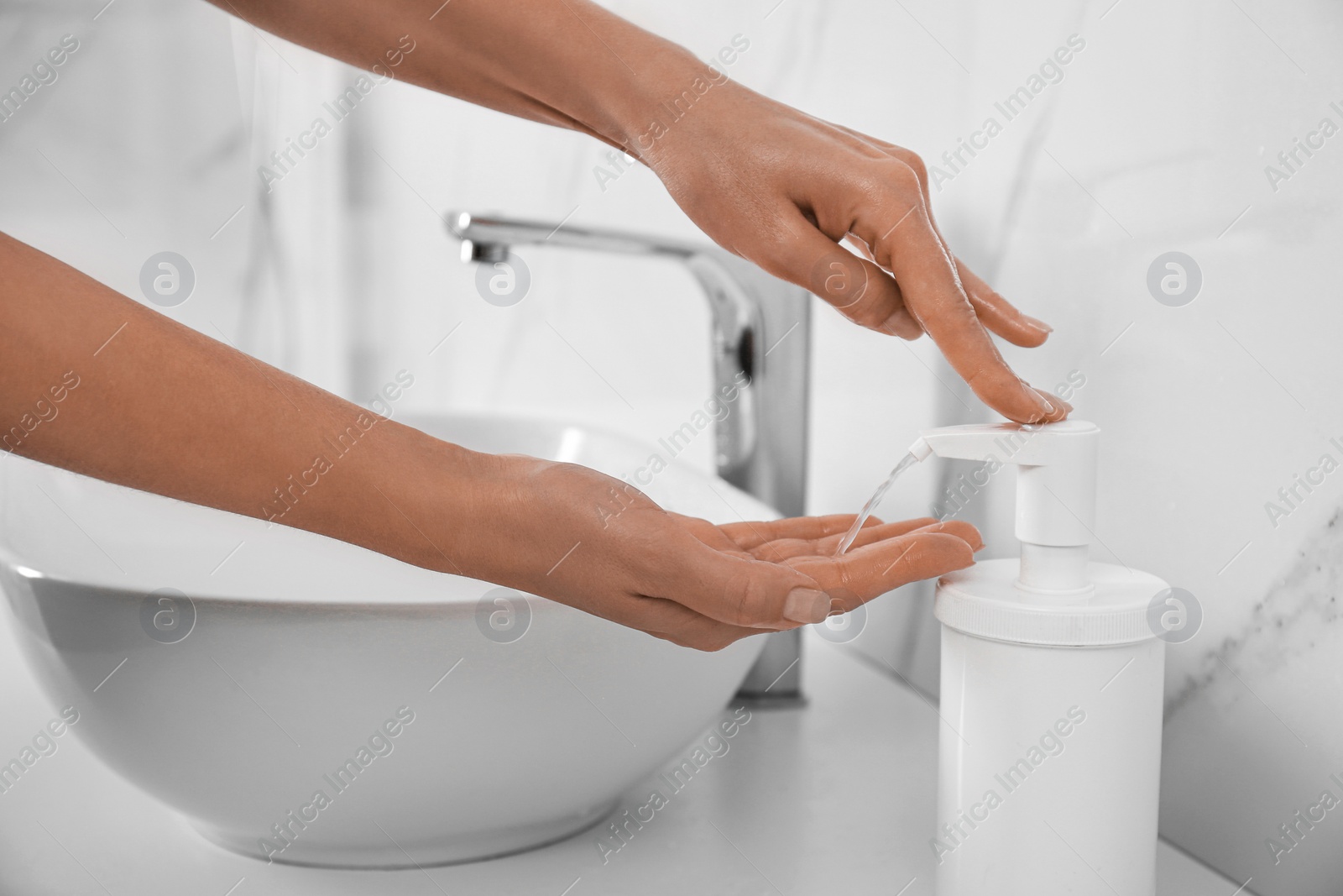 Photo of Woman applying hand sanitizer indoors, closeup. Personal hygiene during COVID-19 pandemic