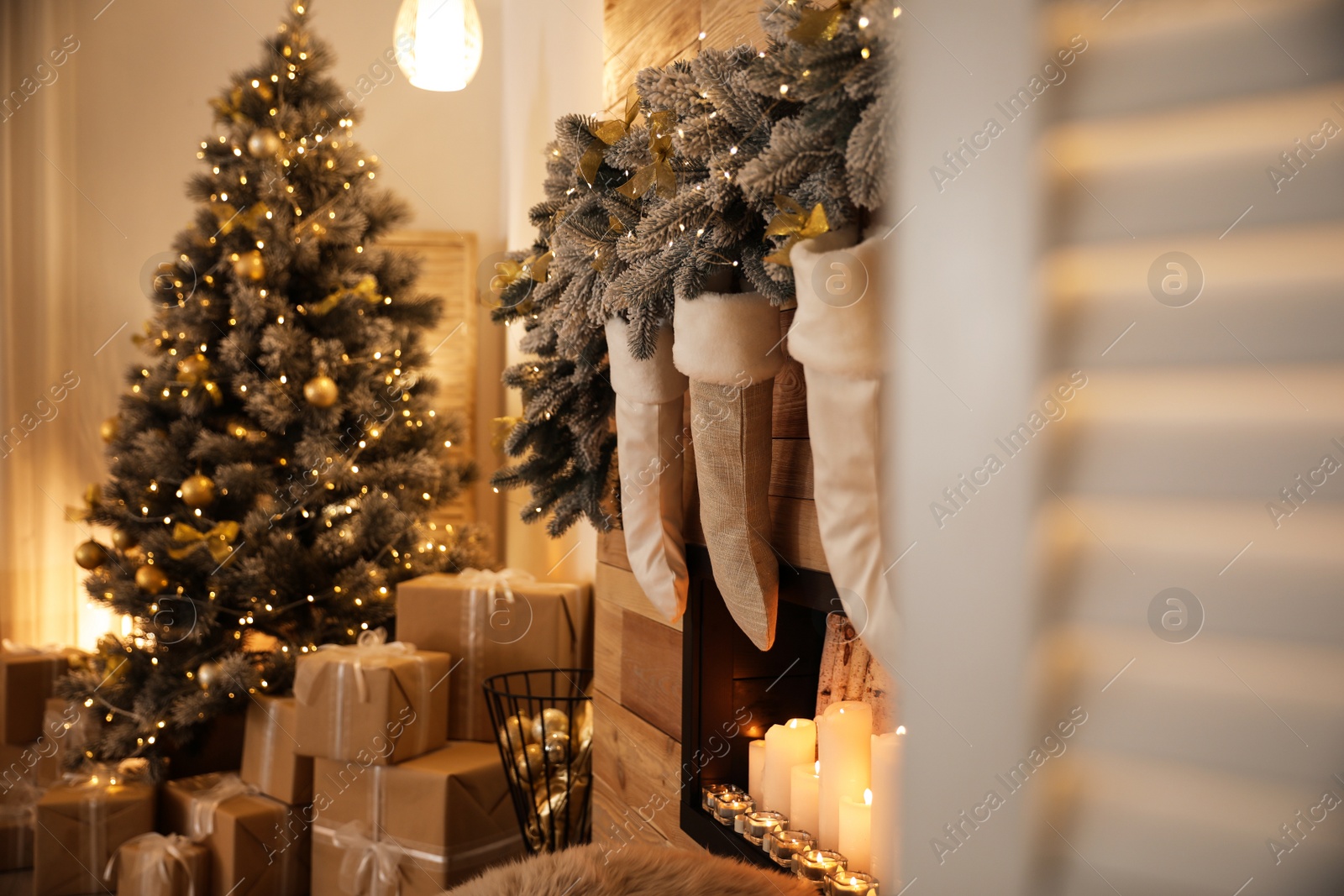 Photo of Stylish room interior with decorative fireplace. Christmas time