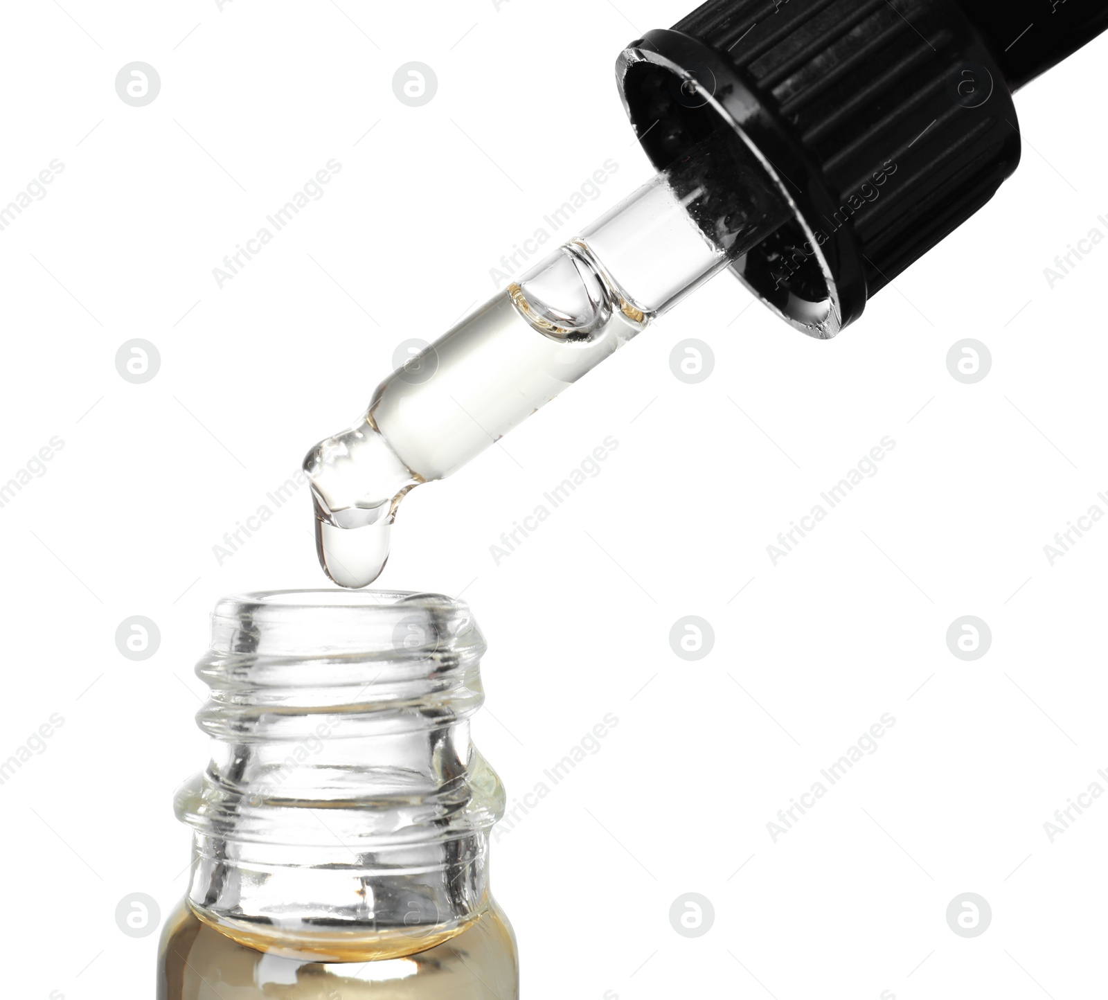 Photo of Bottle and pipette with essential oil on white background, closeup