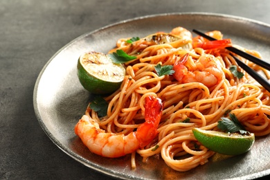 Delicious pasta with shrimps on plate