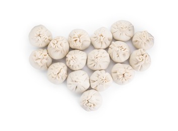 Photo of Many uncooked khinkali (dumplings) isolated on white, top view. Georgian cuisine