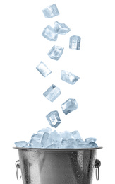 Image of Ice cubes falling into bucket on white background