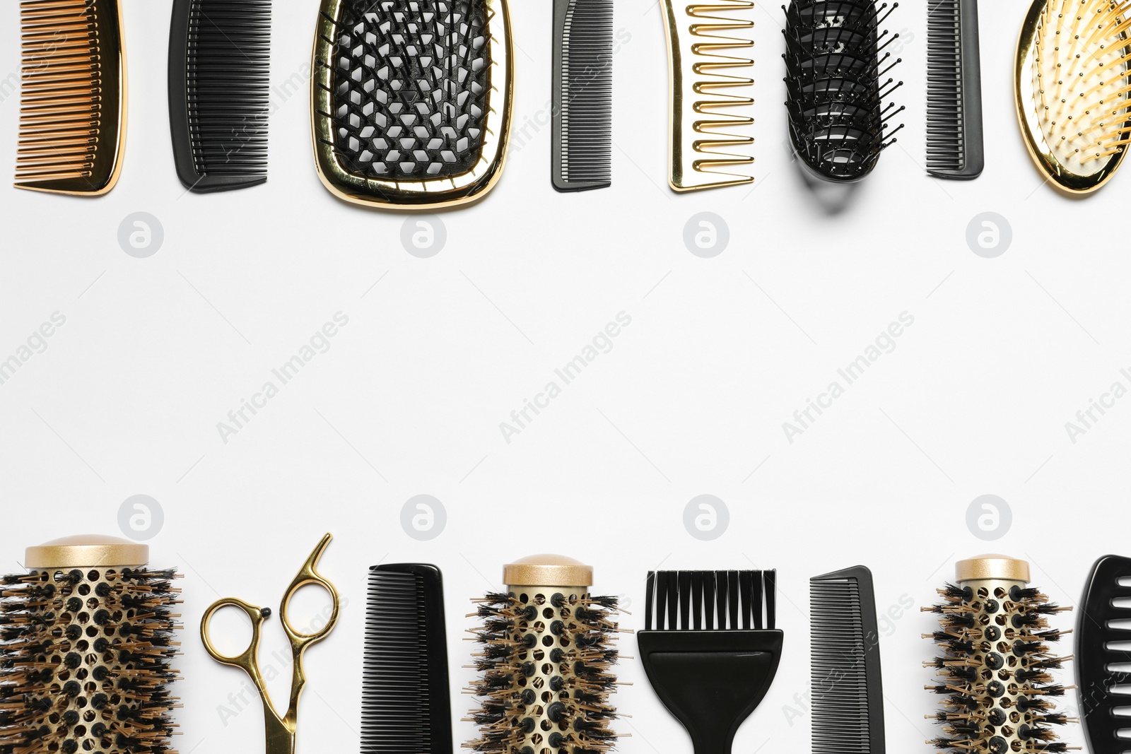 Photo of Hairdressing tools on white background, flat lay. Space for text