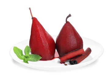 Photo of Tasty red wine poached pears with mint and cinnamon isolated on white