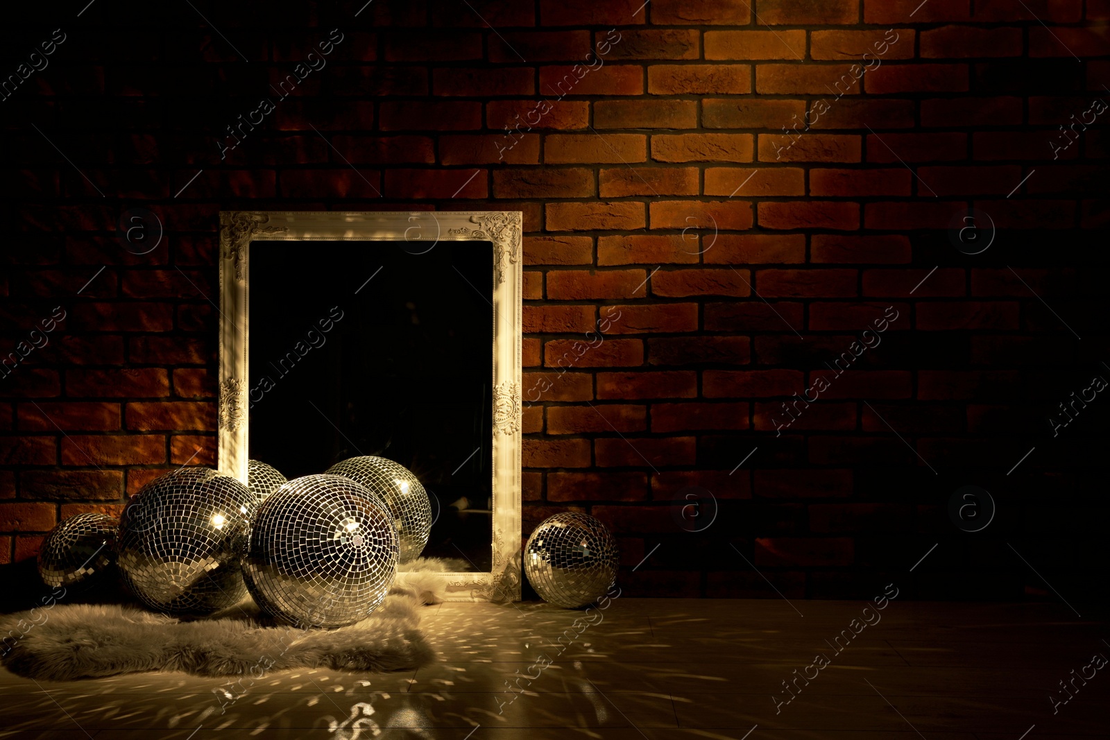 Photo of Many shiny disco balls and mirror in dark room. Space for text