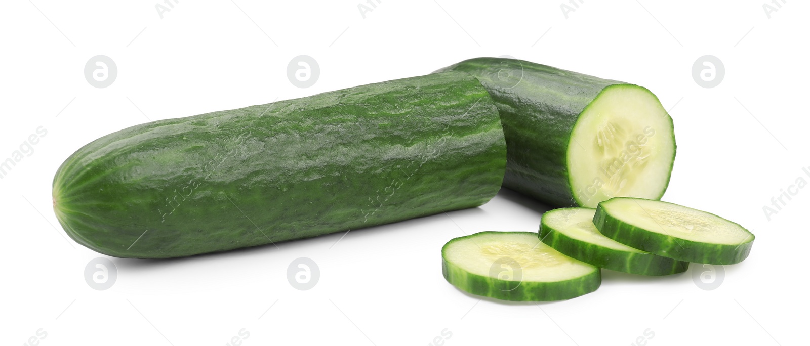 Photo of Halves and slices of long cucumber isolated on white