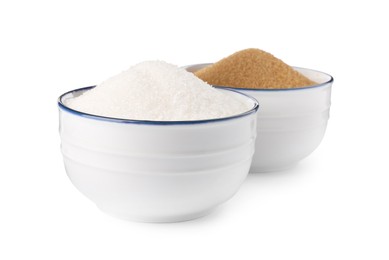 Bowls with different granulated sugar on white background