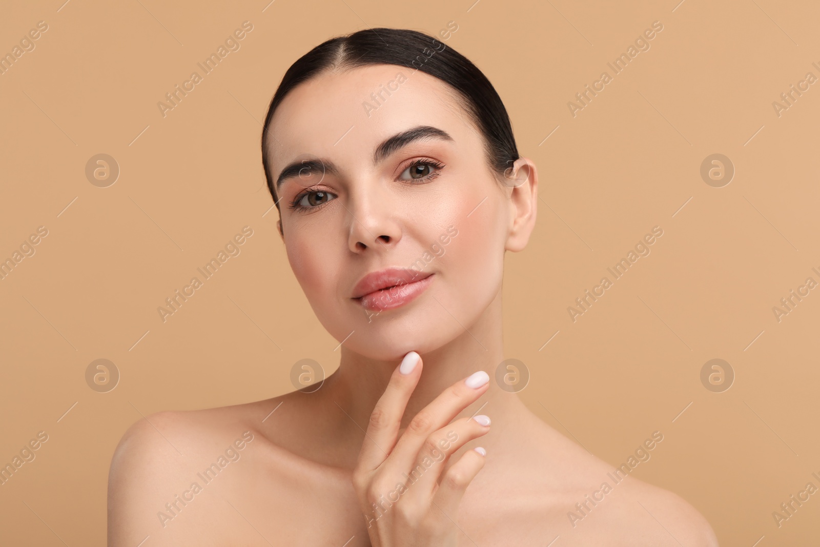 Photo of Beautiful woman with healthy skin on beige background