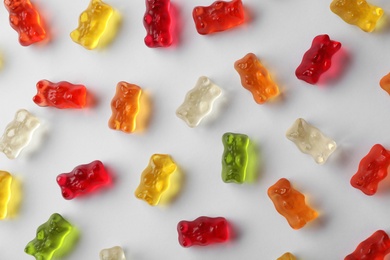 Delicious color jelly bears on white background, top view