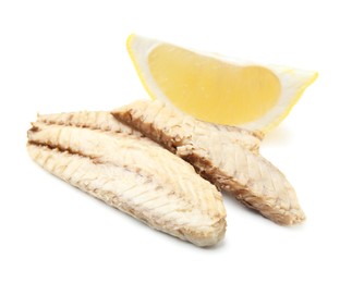 Photo of Canned mackerel fillets with lemon on white background
