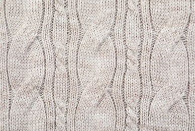 Texture of cozy warm sweater as background, closeup