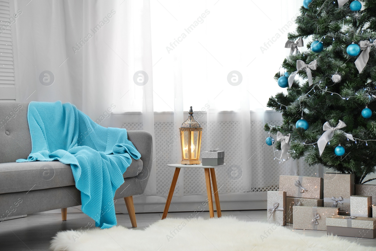 Photo of Stylish living room interior with decorated Christmas tree