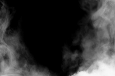 Image of White smoke on black background. Space for text