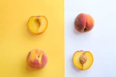 Photo of Flat lay composition with fresh peaches on color background