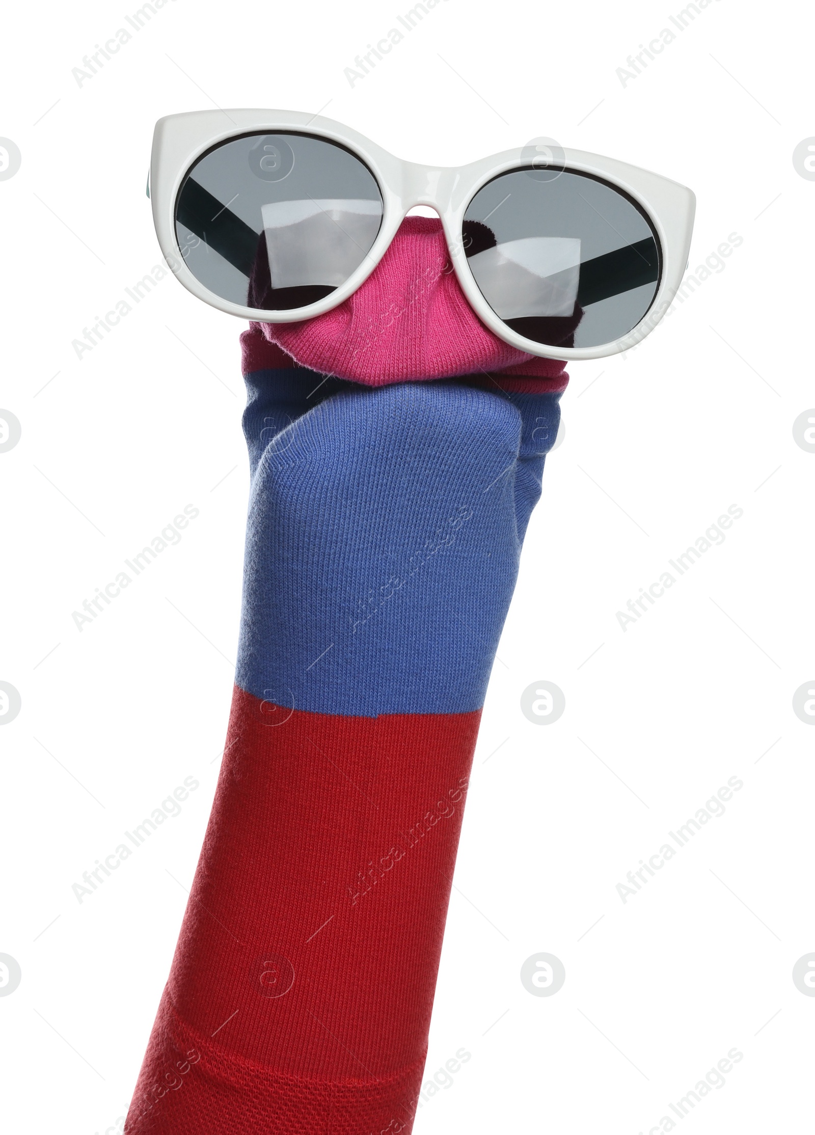 Photo of Funny sock puppet with sunglasses isolated on white