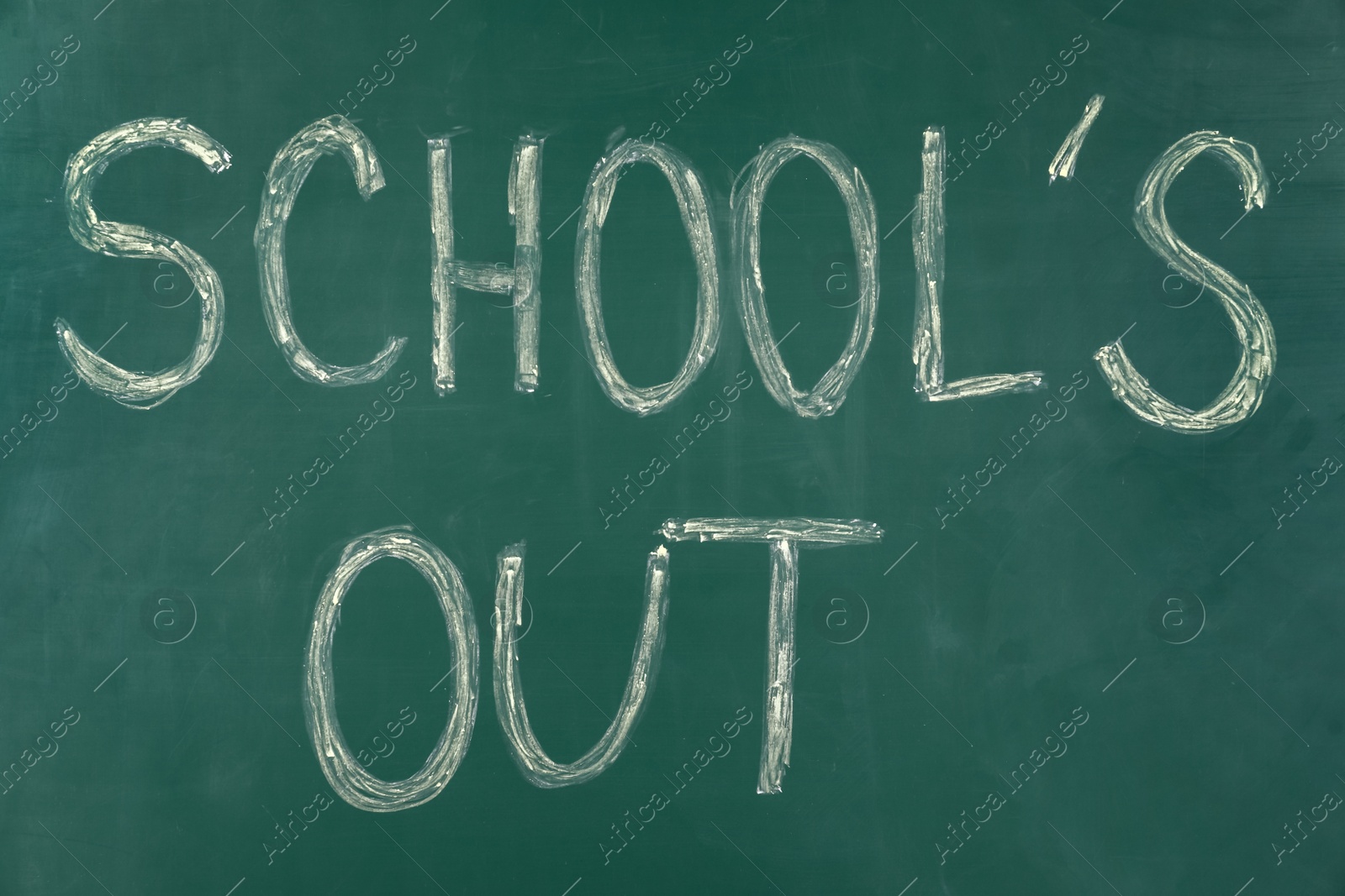 Photo of Text School's Out written on green chalkboard. Summer holidays