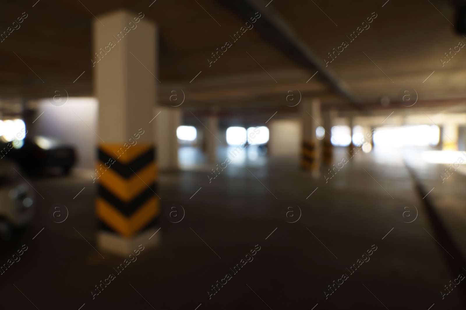 Photo of Blurred view of modern car parking garage